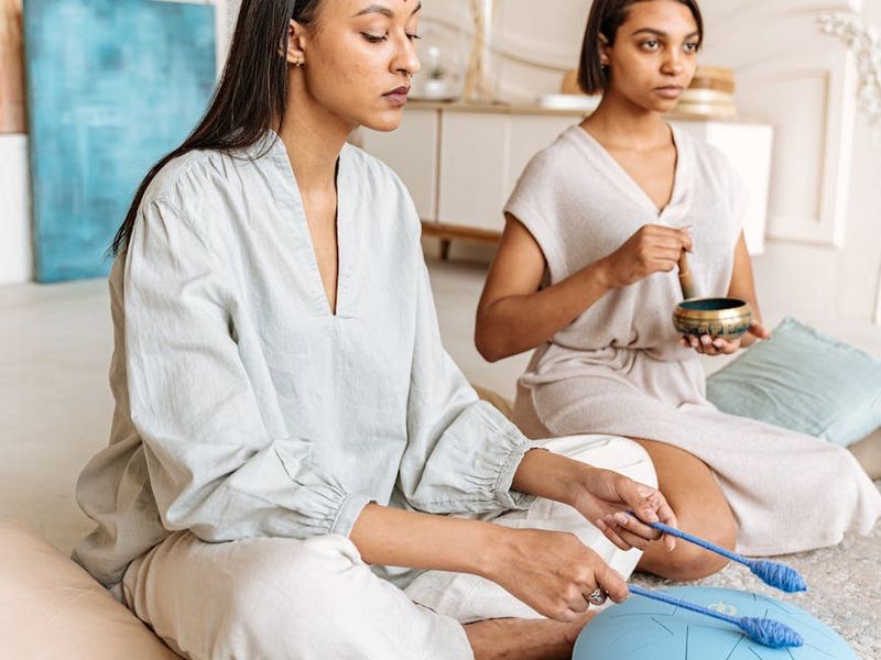 A calm and spacious room for yoga practice with minimalist decor.
